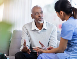 A man talks with a doctor